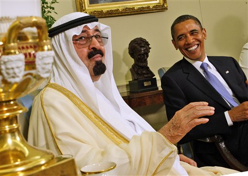 President Barack Obama and Saudi Arabia's King Abdullah, share a light moment as they meet, Tuesday, June 29, 2010, in the Oval Office of the White House in Washington. (AP Photo/Ron Edmonds)